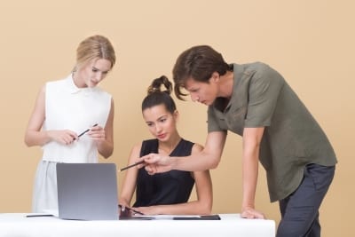 Canva-Two-Woman-and-One-Man-Looking-at-the-Laptop-1-400×267